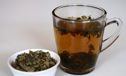 Fig leaf tea and a glass of drink. A great source of fiber and full of vitamins and minerals.