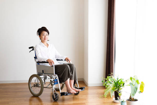 istock Wheelchair and woman 1087362970