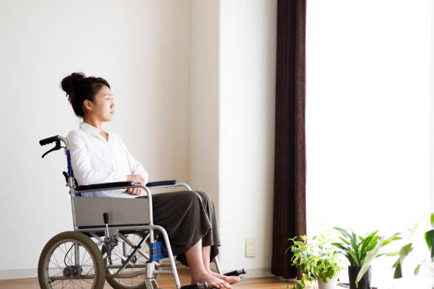 istock Wheelchair and woman 1087362972