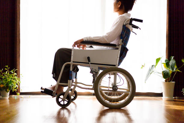 istock Wheelchair and woman 1087362980