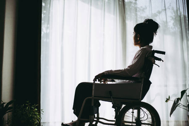 istock Wheelchair and woman 1087362988
