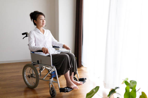 istock Wheelchair and woman 1087363020