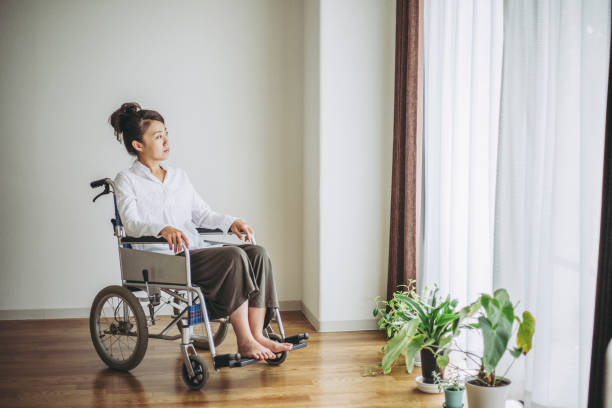 istock Wheelchair and woman 1087363084