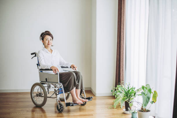 istock Wheelchair and woman 1087363086