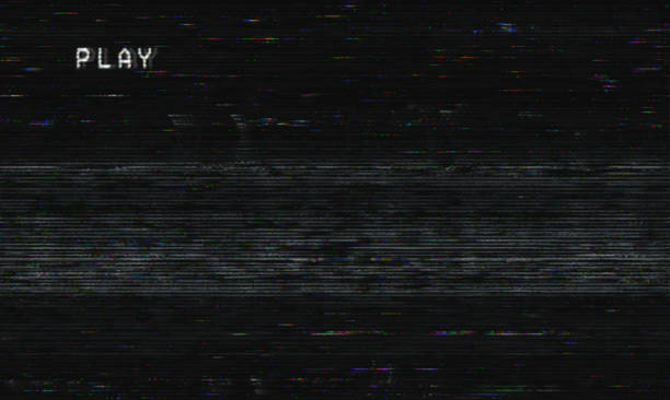 GLITCH! VCR plays damaged videotape on TV, with static and interference. Remember the 1970s and 1980s? A common problem with analog VHS or Betamax -- the damaged videotape. glitch technique photos stock pictures, royalty-free photos & images