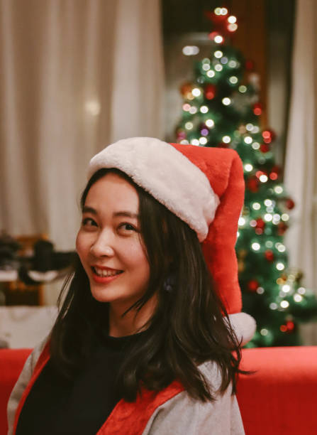 istock Asian Girl under Christmas Tree 1087375470