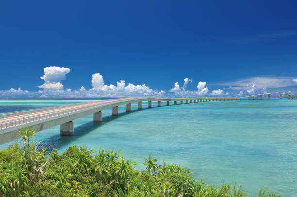 Irabu Ohashi (Irabu Bridge) connecting Irabu island with Miyako island. This bridge is the longest free bridge over the sea in Japan. You will enjoy 3.54km of awesome driving with amazing views.The Sea is so blue and clear. The blue is not just one kind of blue, which mixed with green, tiffany blue, and so on. sea bridge stock pictures, royalty-free photos & images