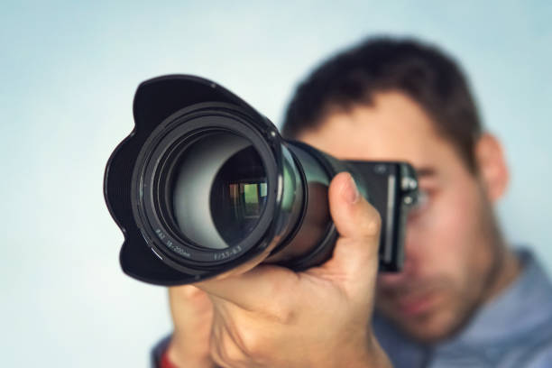 istock male photographer hold camera in his hands 1087409684