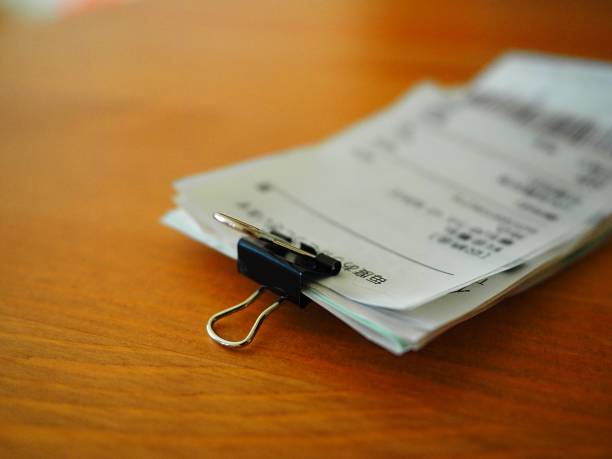 istock Grocery shopping receipts and on wood table 1087411330