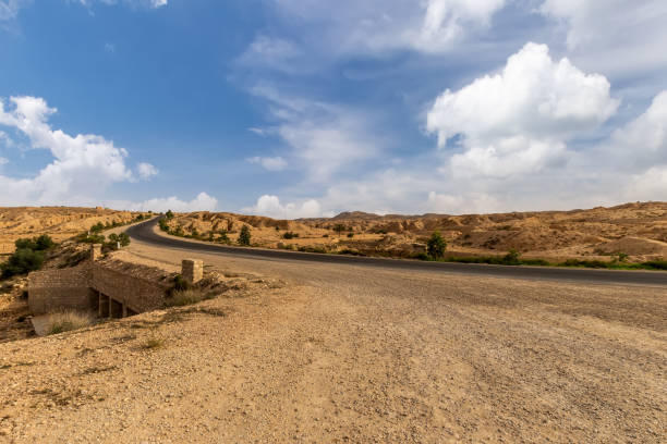 istock Road at Sahara desert in the afternoon. 1087415342