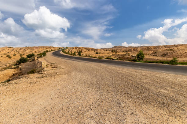 istock Road at Sahara desert in the afternoon. 1087415384