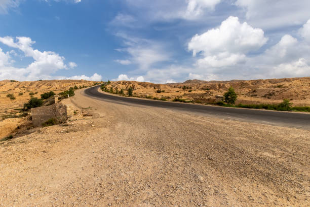 istock Road at Sahara desert in the afternoon. 1087415416