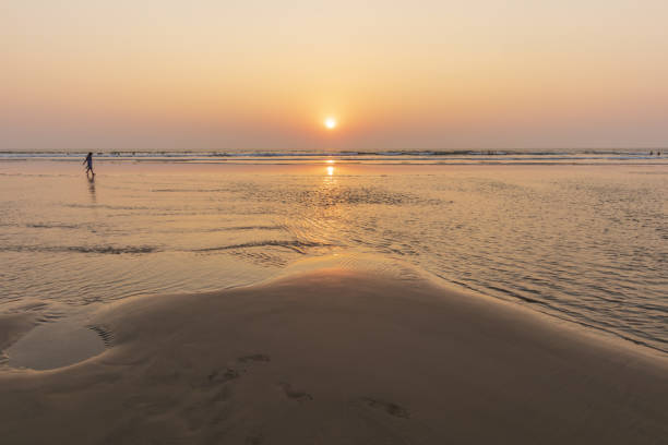 istock Sunset on Mandrem beach in Goa, India. 1087424088