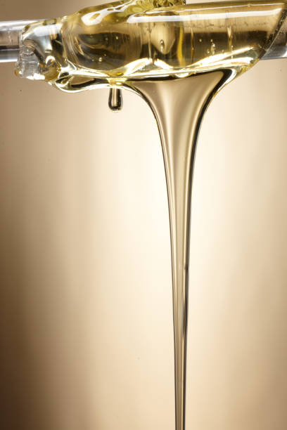 istock oil flowing shape. syrup flowing shape. 1087427312