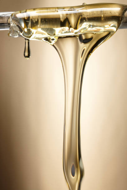 istock oil flowing shape. syrup flowing shape. 1087427340