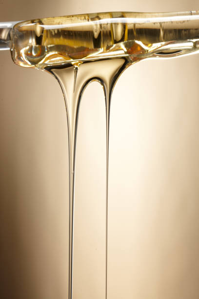istock oil flowing shape. syrup flowing shape. 1087427352