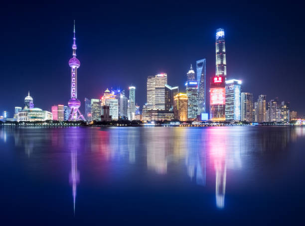 istock shanghai skyline at night and beautiful reflections 1087428730