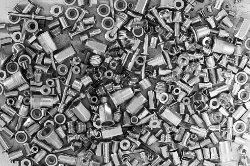 Much of screws on the cement surface, black and white for textured background or wallpaper