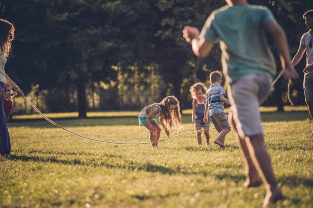 istock Group of children playing in public park 1087442154