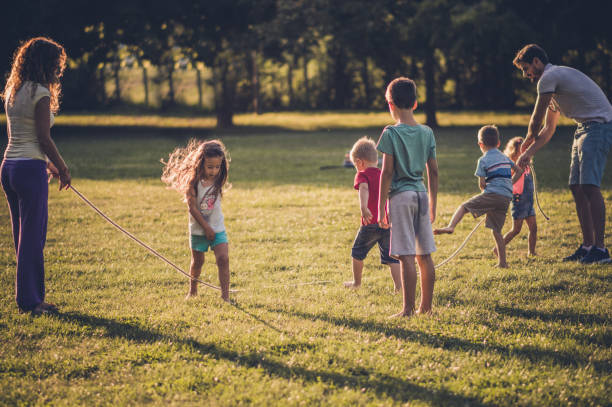 istock Group of children playing in public park 1087442278