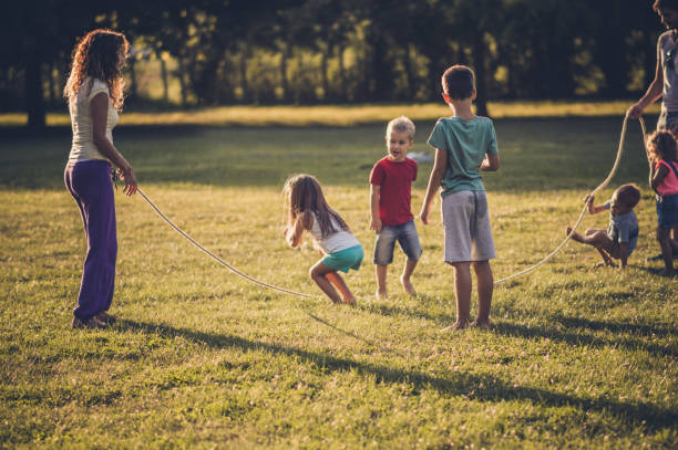 istock Group of children playing in public park 1087442406