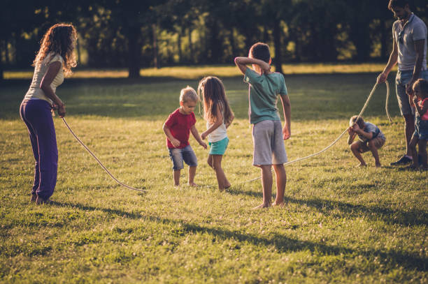 istock Group of children playing in public park 1087444542