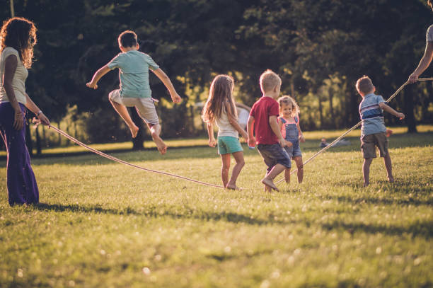 istock Group of children playing in public park 1087444746