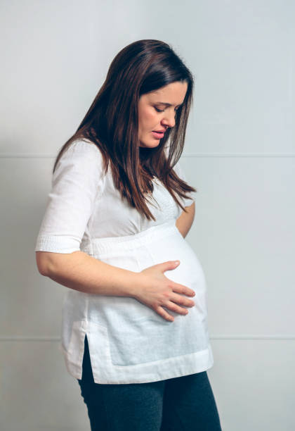 istock Pregnant with belly pain 1087447448