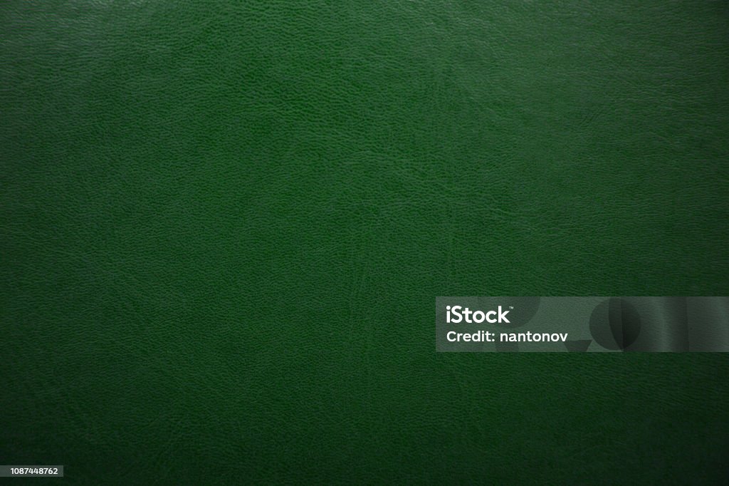 Green textured leather background. Abstract leather texture. Green textured leather background. Abstract leather texture Green Color Stock Photo