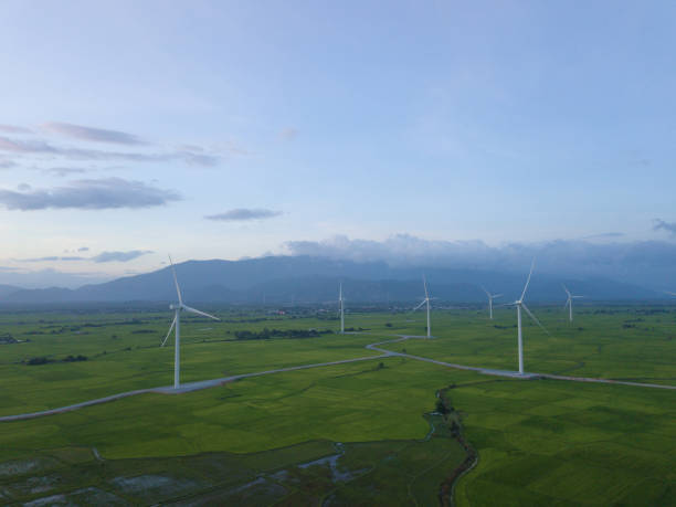 istock Wind turbine farm, windmill on a summer sky 1087450530