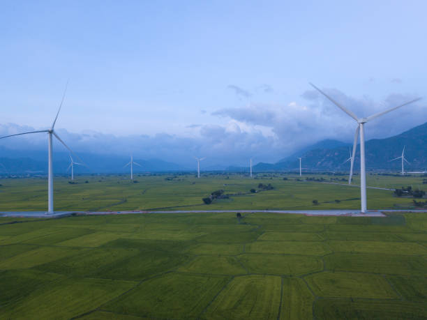 istock Wind turbine farm, windmill on a summer sky 1087450532