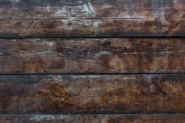 istock Fragment of the old ship’s board soaked in various oils and solutions, which is under the influence of weather conditions and time for a long time 1087453144