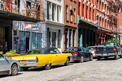 New York City, USA - June 25, 2018: Street scene with classic yellow Cadillac Eldorado convertible car in Tribeca District of Manhattan a sunny day of summer