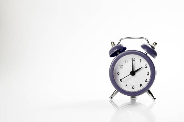 istock Dark alarm clock with shadow and space for your presentation text. 1087455556