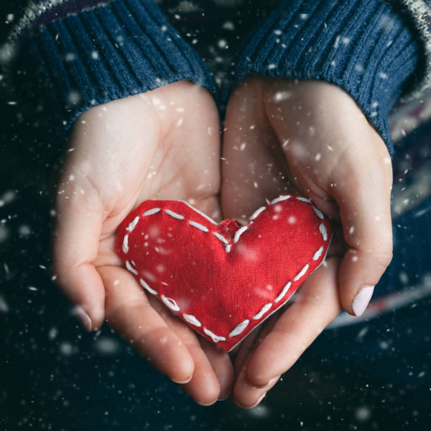 istock Female hands giving red heart. Close up. 1087456964