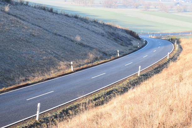 istock winding Eifel road in winter 1087484660