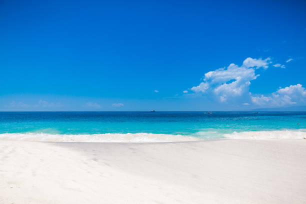 istock Tropical beach with white sand and blue ocean in Maldives 1087486424