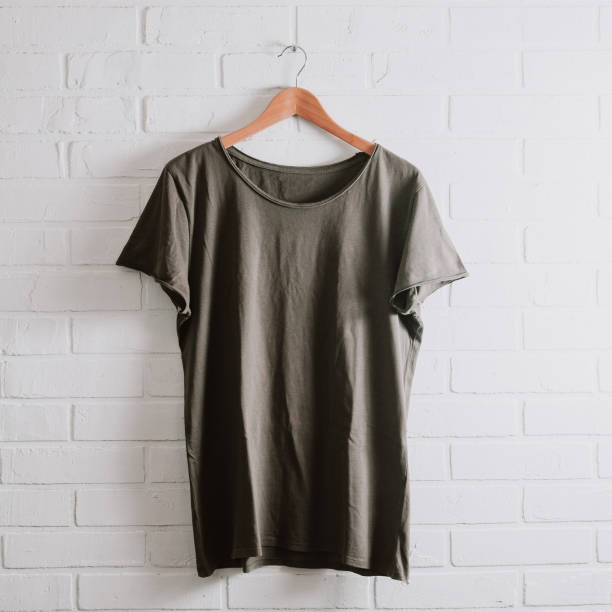 istock Men's t-shirt on a white brick wall 1087486928