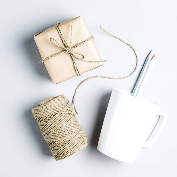 istock Clew of rope and gift on a light background. Place for text 1087486954