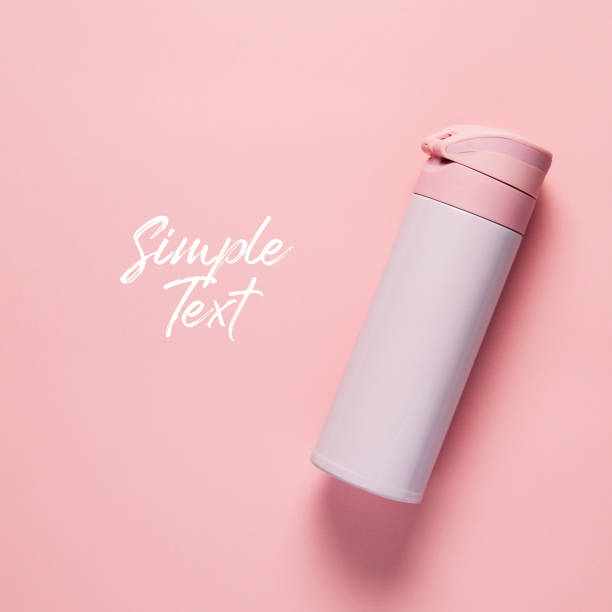 istock Pink thermos on pink background 1087487132