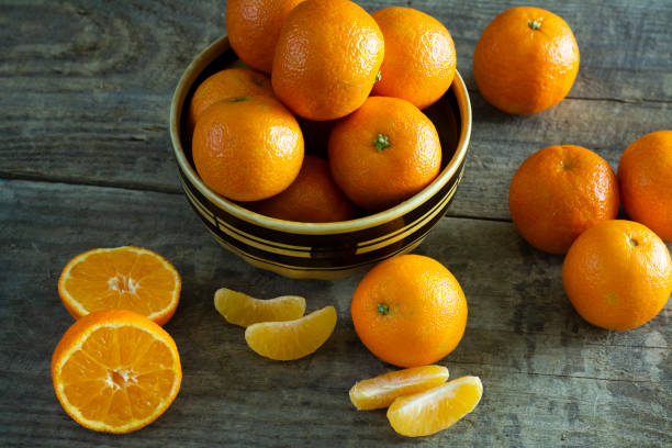 istock tangerines on a wooden background 1087487184