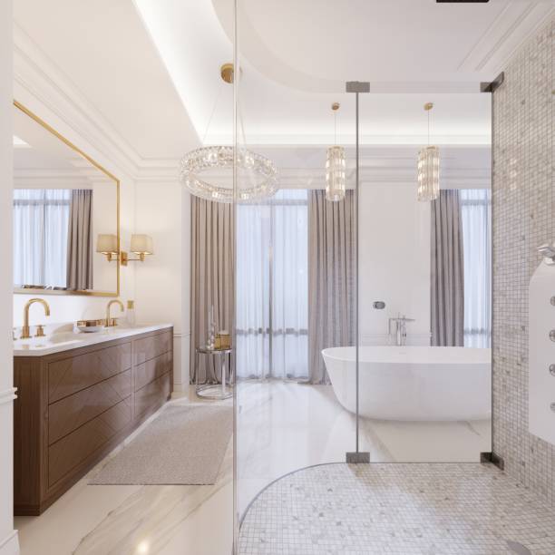 istock Modern bathroom with vanity and a mirror in a gold frame with sconces on the wall, a low table with decor, shower and a fashionable bath. 1087490160
