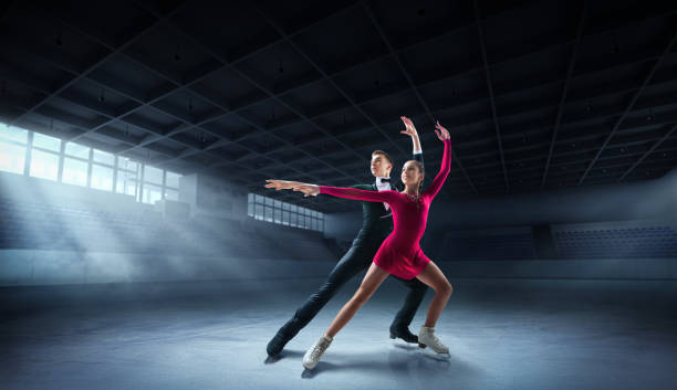 Figure skating couple Figure skating in ice arena figure skating stock pictures, royalty-free photos & images