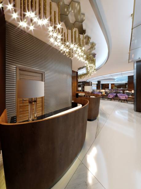 istock Reception area in a modern hotel with wooden reception counters and large pendant gilded chandeliers. 1087494908