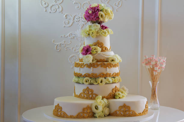 istock Big white wedding cake with flowers and ornaments 1087496684
