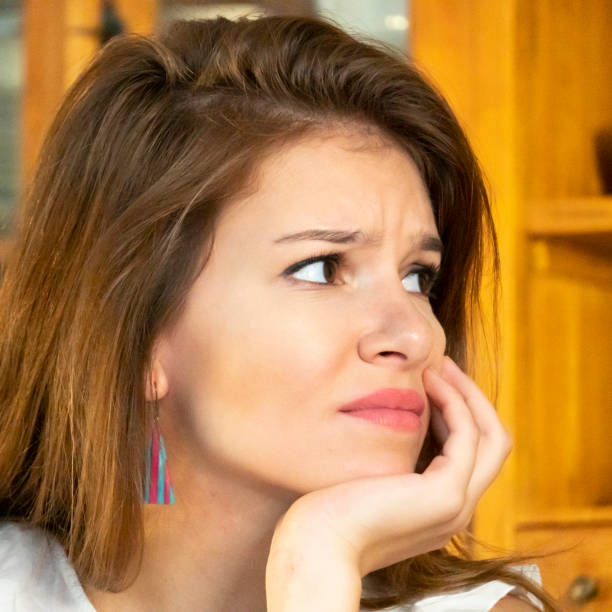 istock Thoughtful young woman looking away 1087499654