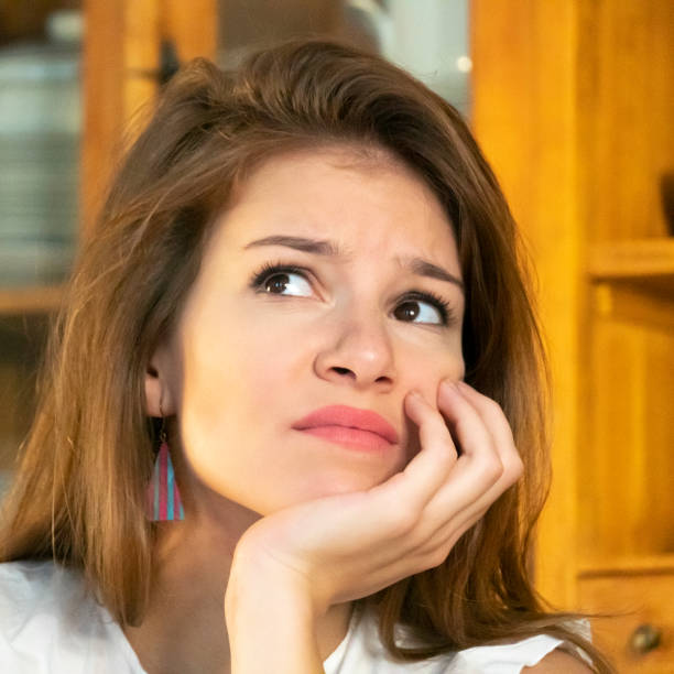 istock Thoughtful young woman looking away 1087499688