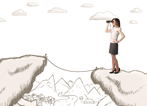 Businesswoman standing on the hand drawn edge of mountain