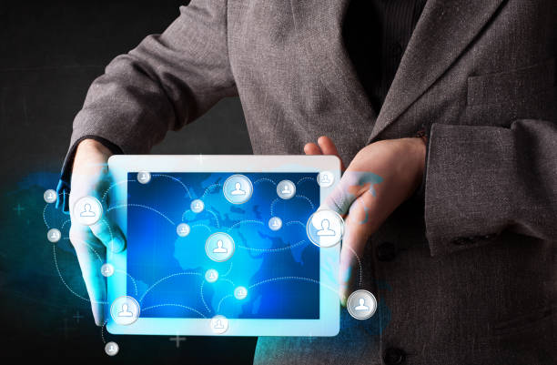 istock Young person holding talbet with communication technology concept 1087507938