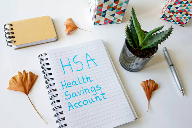 HSA health savings account written in a notebook stock photo